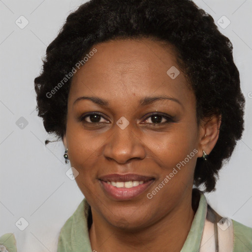 Joyful black adult female with short  brown hair and brown eyes