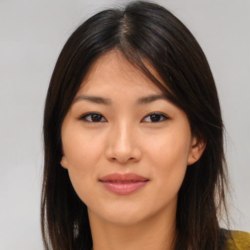 Joyful asian young-adult female with medium  brown hair and brown eyes