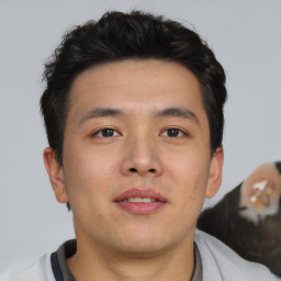 Neutral asian young-adult male with short  brown hair and brown eyes