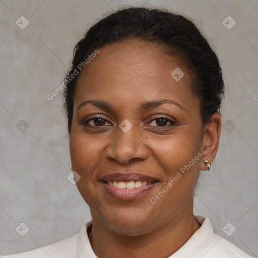 Joyful black adult female with short  brown hair and brown eyes