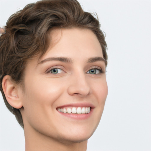 Joyful white young-adult female with short  brown hair and green eyes