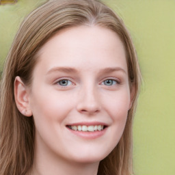 Joyful white young-adult female with long  brown hair and blue eyes