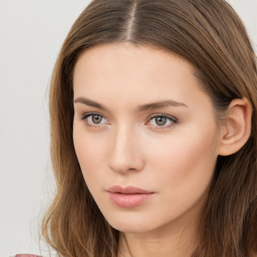 Neutral white young-adult female with long  brown hair and brown eyes