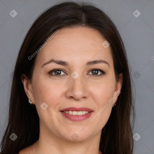 Joyful white adult female with long  brown hair and brown eyes