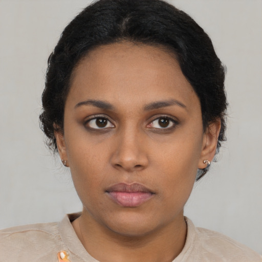 Neutral latino young-adult female with short  brown hair and brown eyes