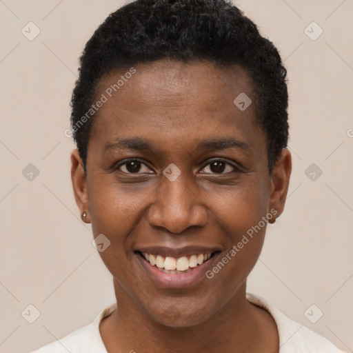 Joyful black young-adult female with short  brown hair and brown eyes