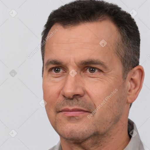 Joyful white adult male with short  brown hair and brown eyes