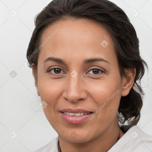 Joyful white adult female with medium  brown hair and brown eyes