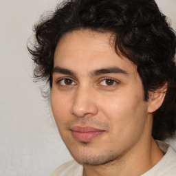 Joyful white young-adult male with medium  brown hair and brown eyes