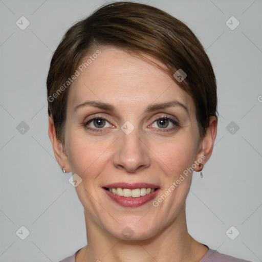 Joyful white young-adult female with short  brown hair and grey eyes