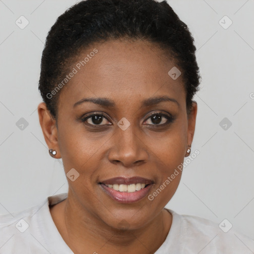 Joyful black young-adult female with short  brown hair and brown eyes