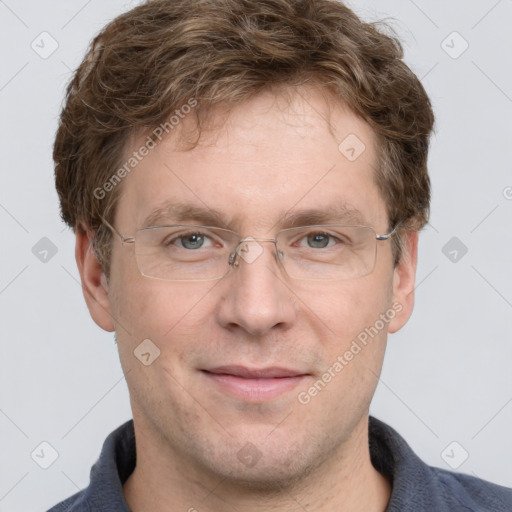 Joyful white adult male with short  brown hair and grey eyes