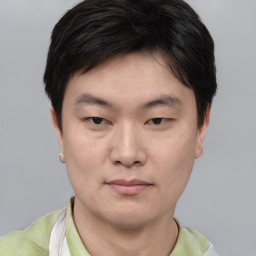 Neutral asian young-adult male with short  brown hair and brown eyes