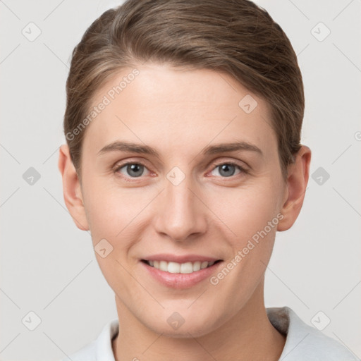 Joyful white young-adult female with short  brown hair and grey eyes