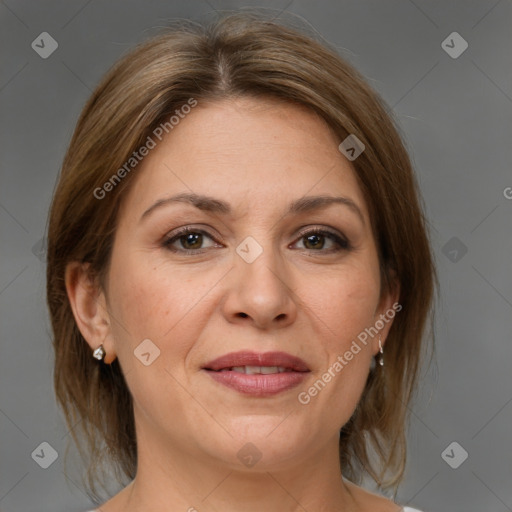 Joyful white adult female with medium  brown hair and brown eyes