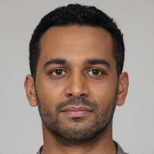 Neutral latino young-adult male with short  black hair and brown eyes