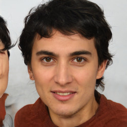 Joyful white young-adult male with medium  brown hair and brown eyes