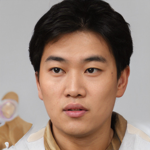 Neutral asian young-adult male with short  black hair and brown eyes
