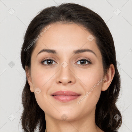 Joyful white young-adult female with long  brown hair and brown eyes