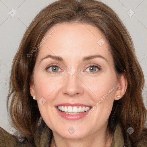 Joyful white adult female with medium  brown hair and grey eyes