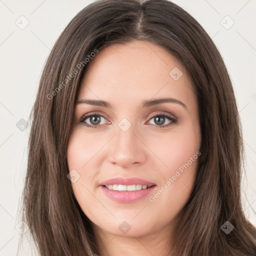 Joyful white young-adult female with long  brown hair and green eyes