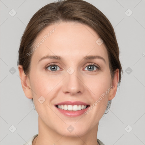 Joyful white young-adult female with medium  brown hair and green eyes