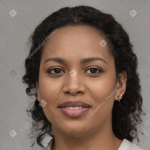 Joyful black young-adult female with long  brown hair and brown eyes