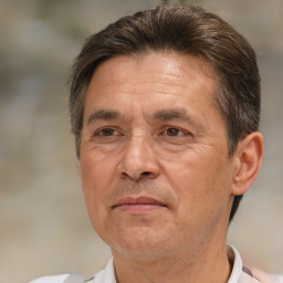 Joyful white middle-aged male with short  brown hair and brown eyes