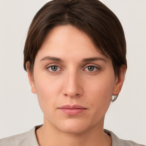 Neutral white young-adult female with short  brown hair and brown eyes