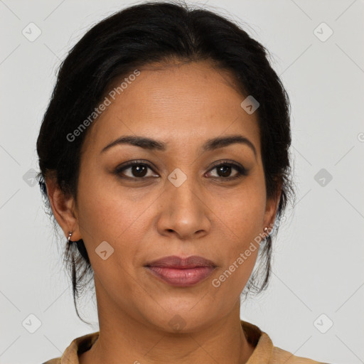 Joyful latino adult female with medium  brown hair and brown eyes