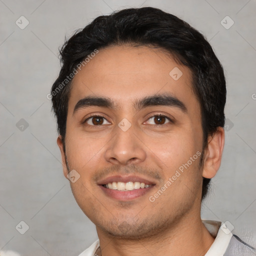 Joyful white young-adult male with short  black hair and brown eyes