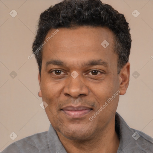 Joyful latino adult male with short  black hair and brown eyes