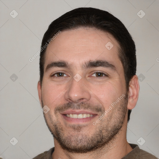 Joyful white young-adult male with short  black hair and brown eyes