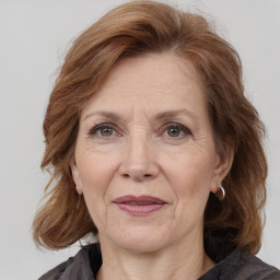 Joyful white middle-aged female with medium  brown hair and brown eyes