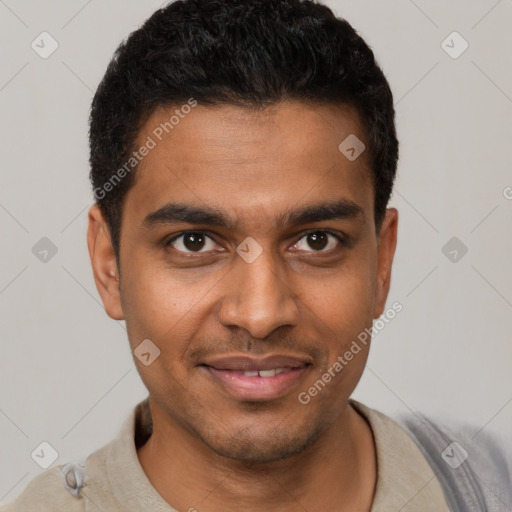 Joyful black young-adult male with short  black hair and brown eyes