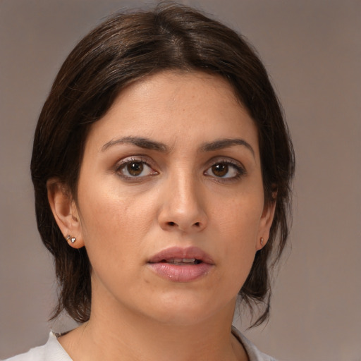 Neutral white young-adult female with medium  brown hair and brown eyes