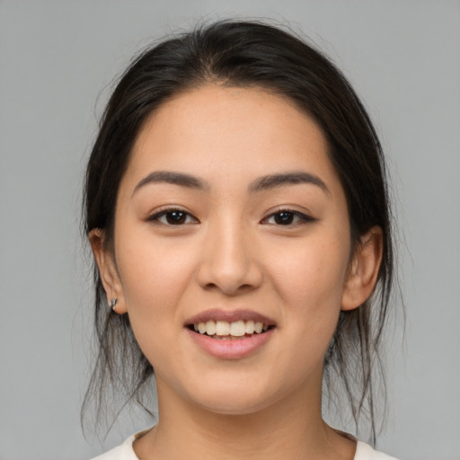 Joyful white young-adult female with medium  brown hair and brown eyes