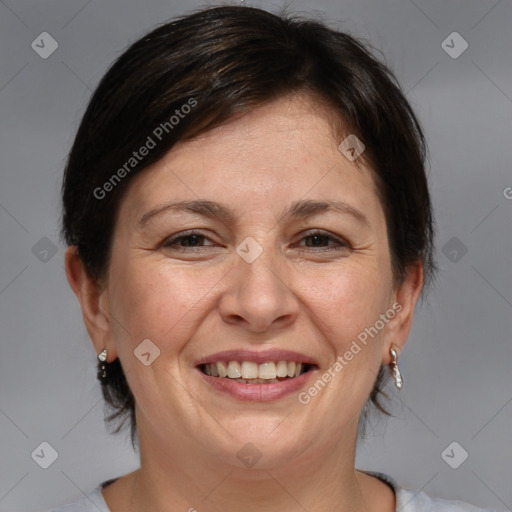 Joyful white adult female with medium  brown hair and brown eyes