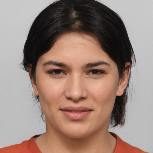 Joyful white young-adult female with medium  brown hair and brown eyes