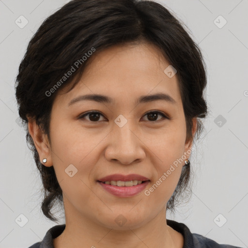 Joyful asian adult female with medium  brown hair and brown eyes