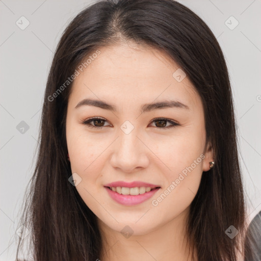 Joyful asian young-adult female with long  brown hair and brown eyes