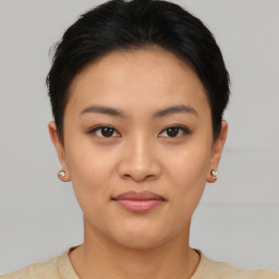 Joyful asian young-adult female with short  brown hair and brown eyes