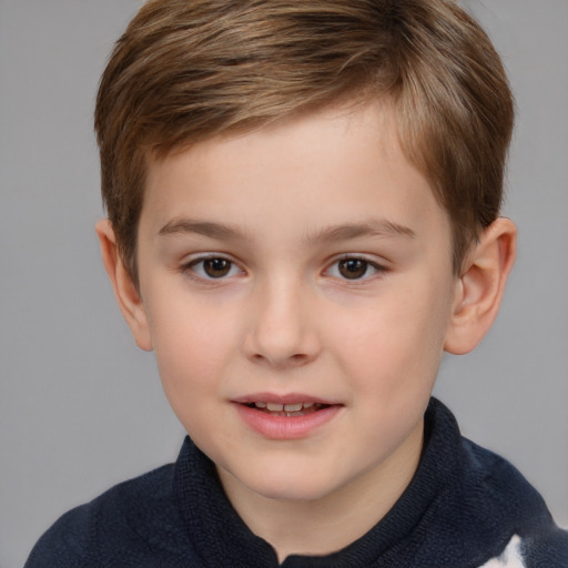 Joyful white child male with short  brown hair and brown eyes