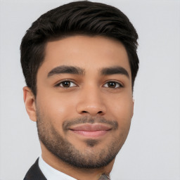 Joyful white young-adult male with short  black hair and brown eyes