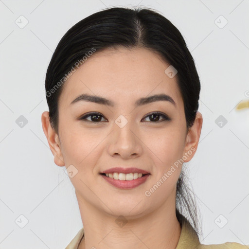 Joyful asian young-adult female with short  black hair and brown eyes