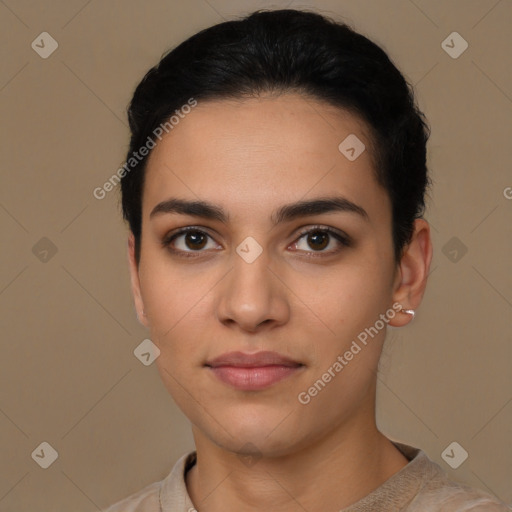 Joyful latino young-adult female with short  brown hair and brown eyes