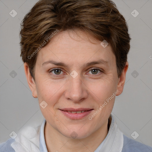 Joyful white adult female with short  brown hair and grey eyes