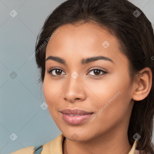 Joyful latino young-adult female with long  brown hair and brown eyes