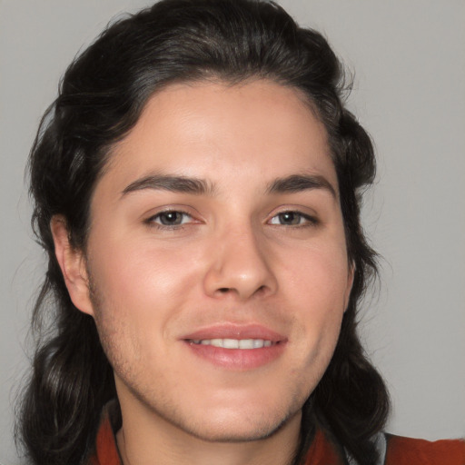 Joyful white young-adult male with medium  brown hair and brown eyes