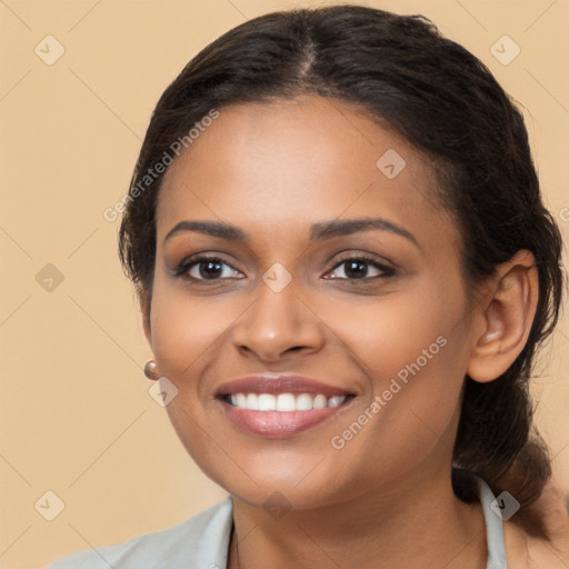 Joyful latino young-adult female with long  brown hair and brown eyes